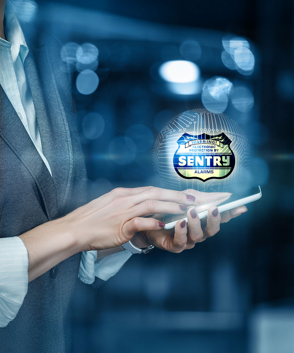 Transfer Your Service - Woman on phone with Sentry Alarms logo glowing above it.